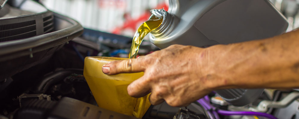 Car Mechanic Replaces Engine Oil - Car Servicing Ipswich